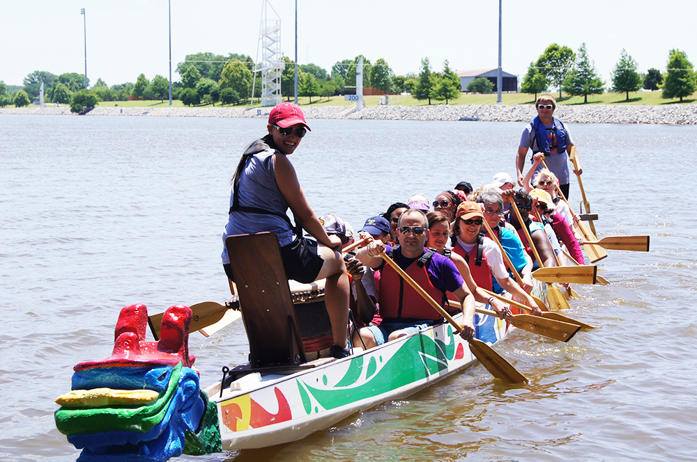 The Fountains at Canterbury group practices rowing technique after loading into the dragon boat.