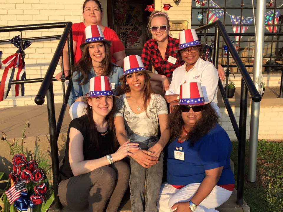 Right: Synergy HomeCare Owner, Weaam Kassem (center) and Staff celebrated Memorial Day early with live entertainment, great food, face painting and activities for all ages.  Clients, caregivers and community enjoyed a patriotic fun filled event held Wednesday, May 25, 2016 at Synergy HomeCare off Bryant Ave in Edmond.