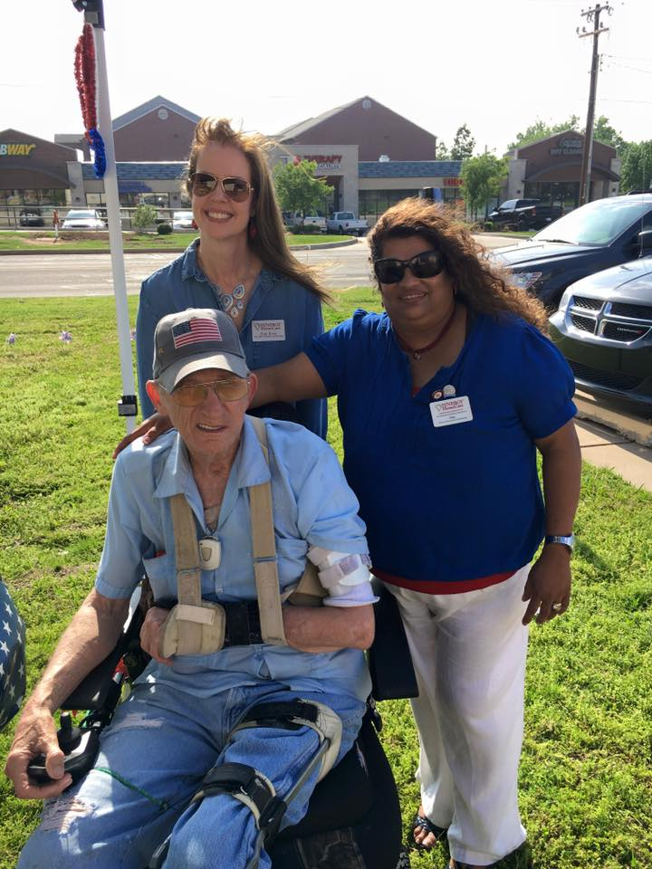 Synergy HomeCare staff members, Pam Ross (Director of Nursing) and Lisa Tippeconnic (Human Resources) visited with Veteran and client, Jimmy Horton,  at their patriotic Memorial Day party held on Wednesday, May 25th at Synergy HomeCare off Bryant Ave in Edmond.